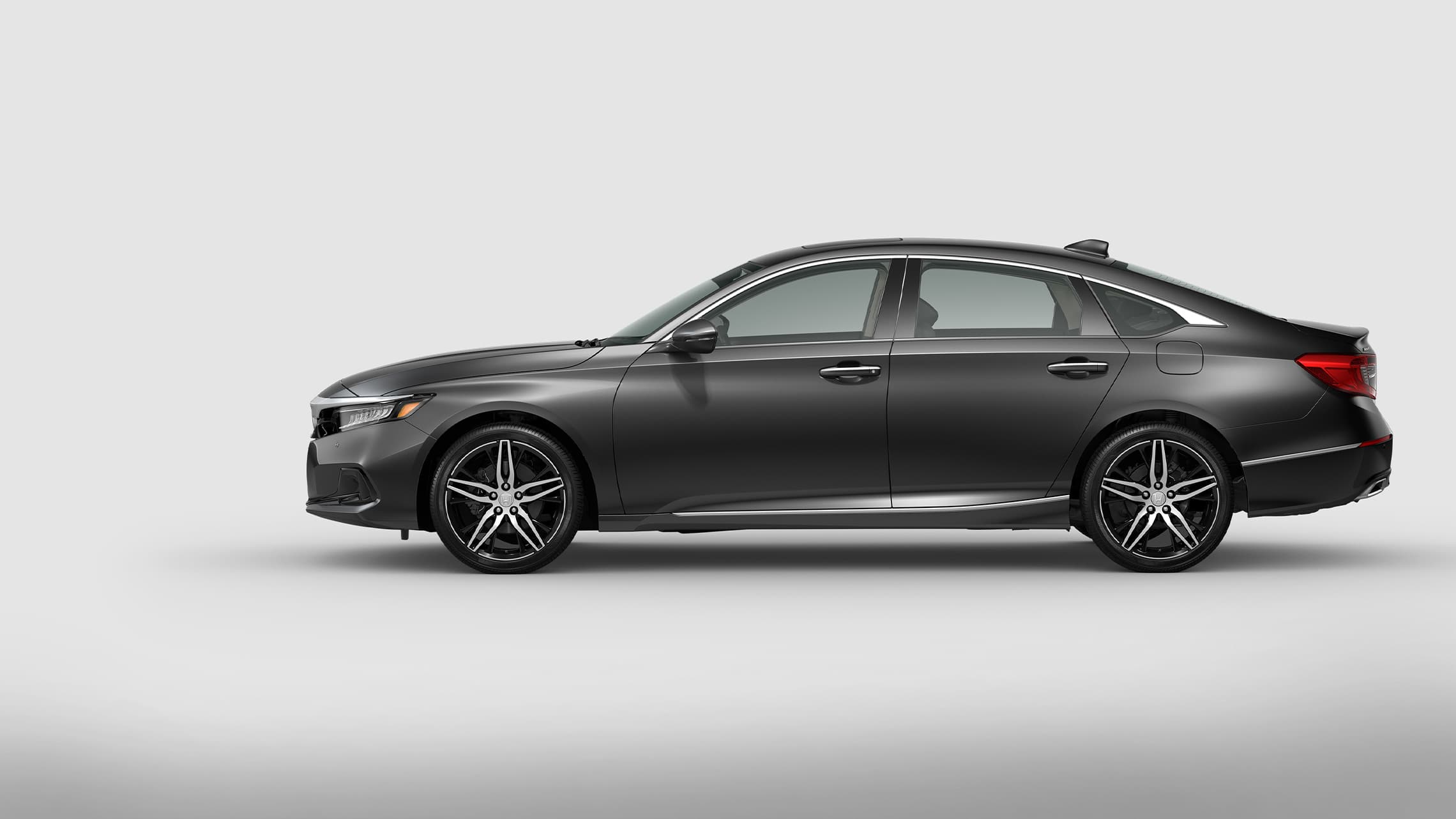 Driver-side profile view of the 2021 Honda Accord Touring 2.0T in Modern Steel Metallic.