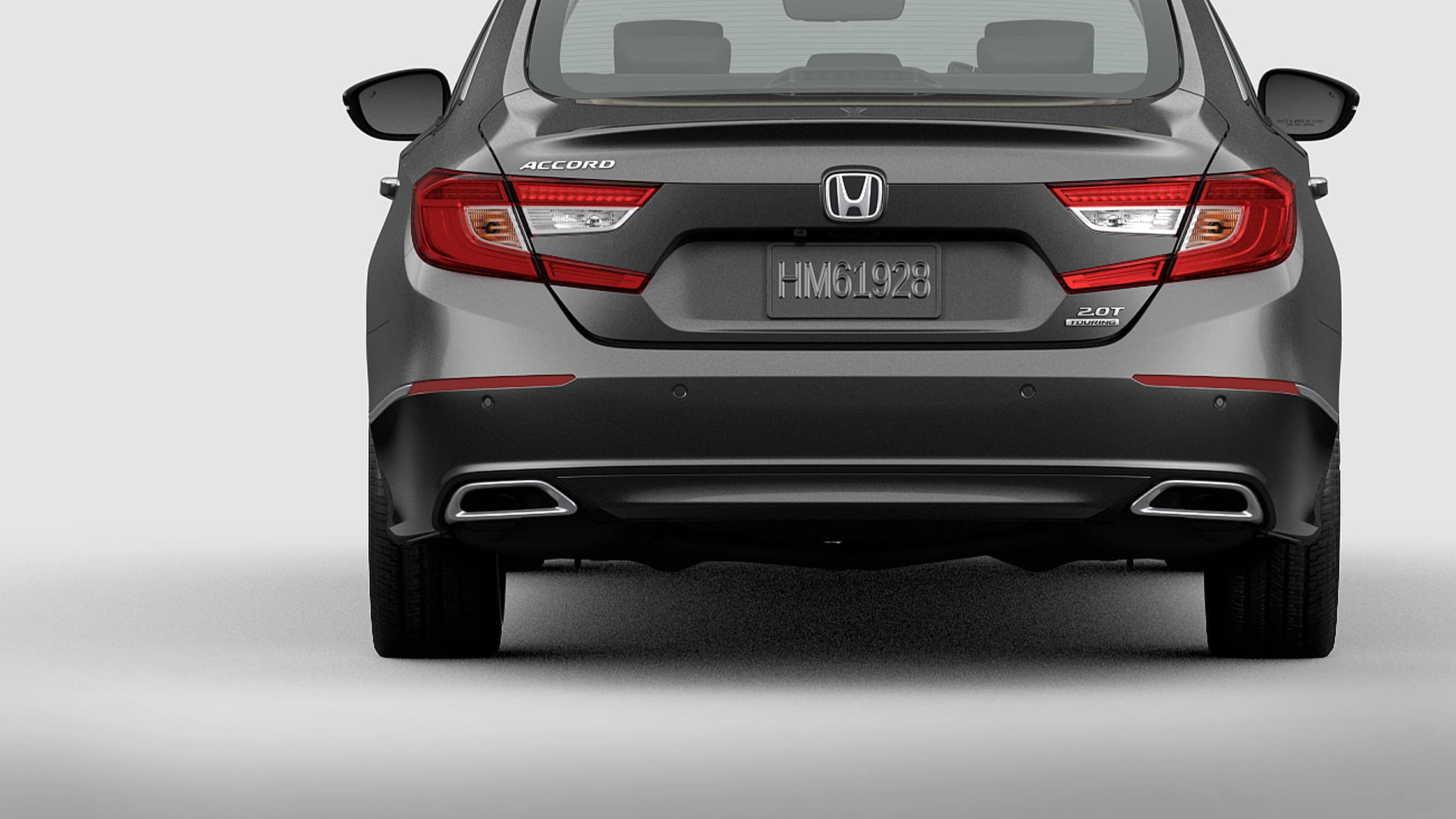 Taillights with integrated LED light bars and parking sensors detail on the 2021 Honda Accord Touring 2.0T in Modern Steel Metallic.