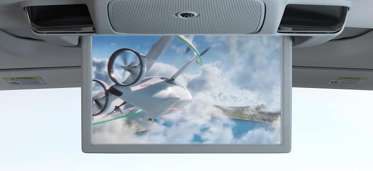 2027 Honda Odyssey trim rear entertainment screen playing video inside the spacious van 3 row cabin layout (Minivan).